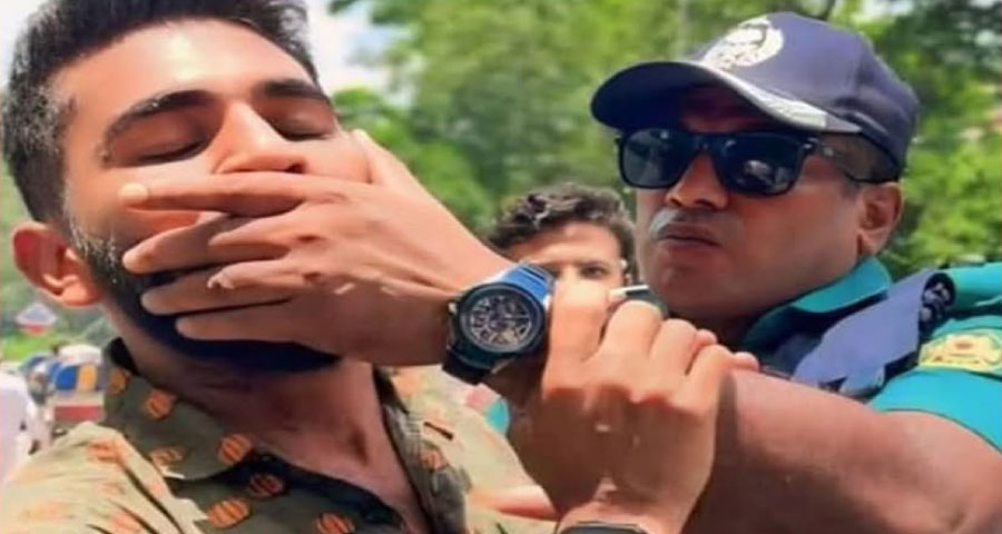 শিক্ষার্থীর মুখ চেপে ধরা সেই পুলিশ কর্মকর্তা গ্রেপ্তার